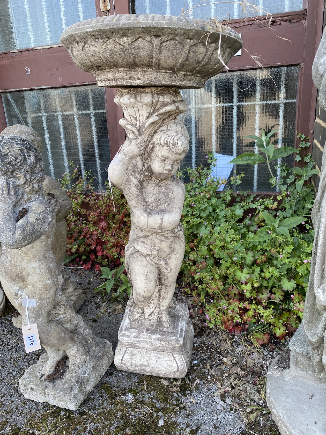 A circular cast stone cherub fountain bird bath, height 92cm